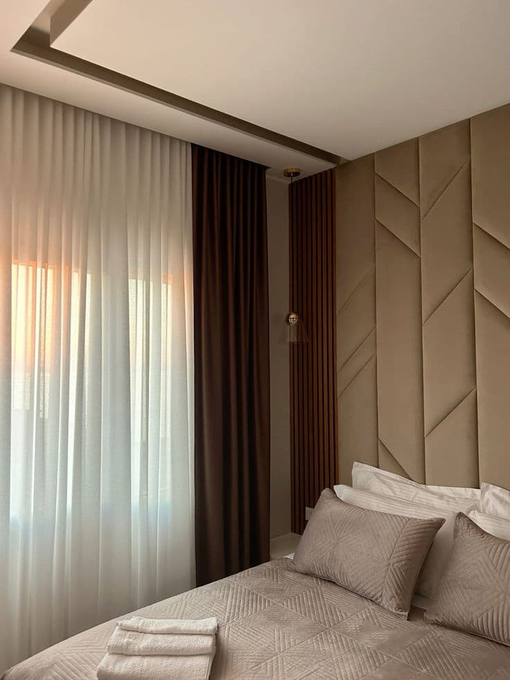 Upholstered bed panel fitted in a bedroom — example 5
