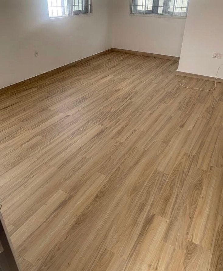 Wooden flooring running through a bright living space