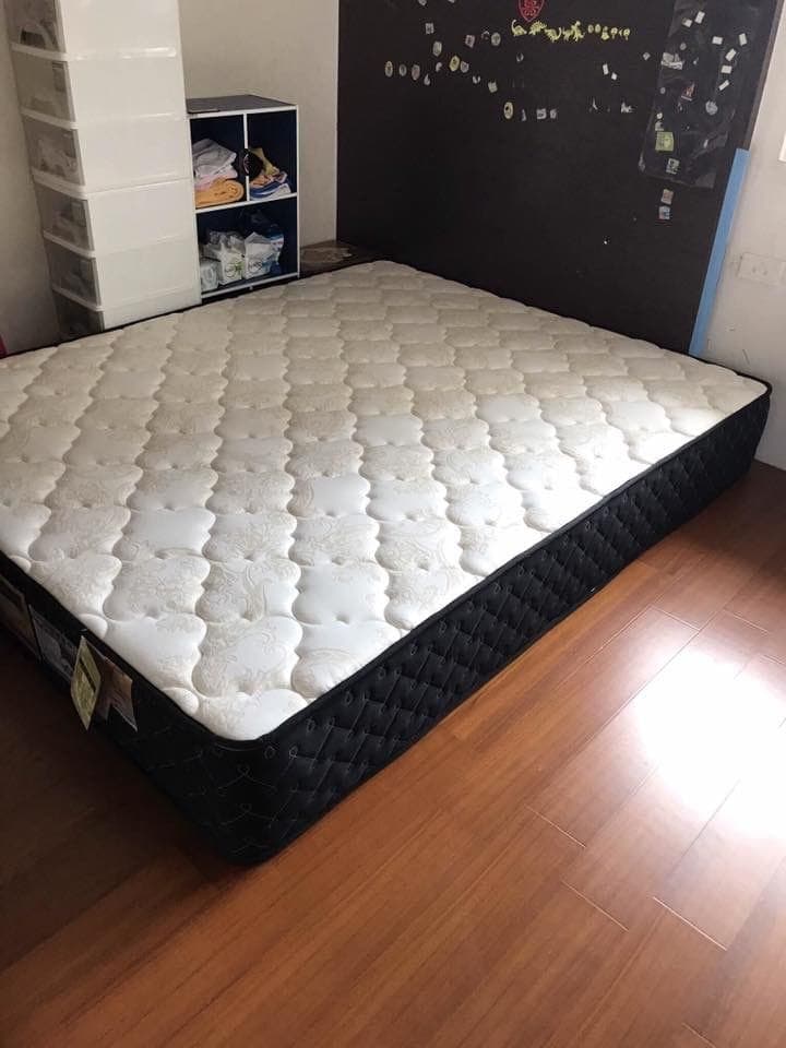 Quilted mattress on a bed frame